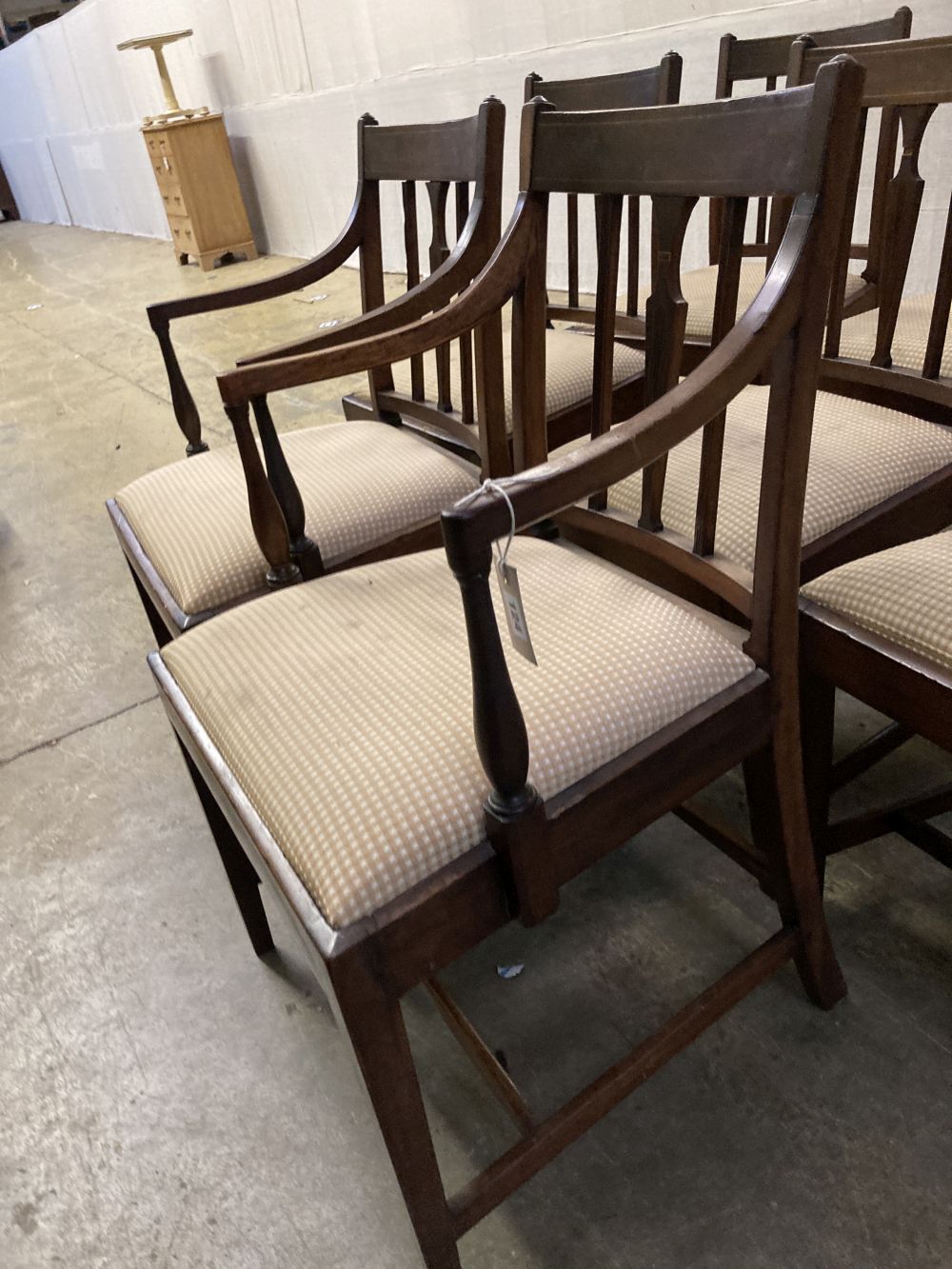 A set of eight late George III mahogany dining chairs, two with arms, six single